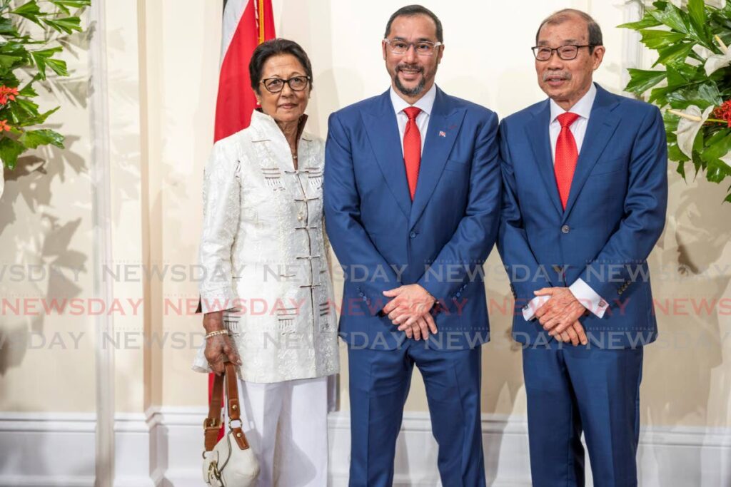 Prime Minister Stuart Young, centre, is joined by his parents Prescilla and Richard at the swearing-in ceremony at the President's House, St Ann's on March 17. - Photo by Jeff K Mayers 