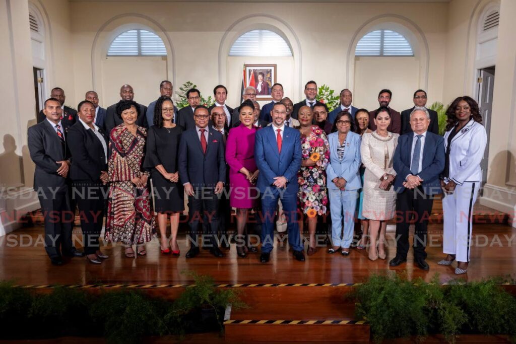 YOUNG'S PICKS: Prime Minister Stuart Young stands with his Cabinet ministers at President's House, St Ann's, on March 17.  - Photo by Jeff K Mayers