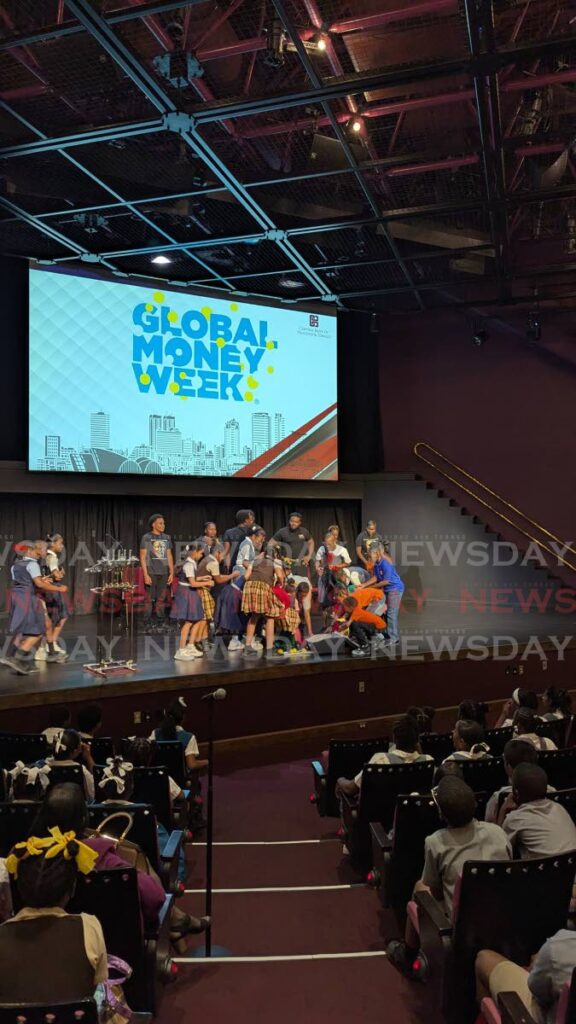 Primary school students in an interactive session with Drama Making a Difference (DMAD) Company at the Central Bank's  Global Money Week event in its auditorium on March 18. - Photo by Mya Quamie