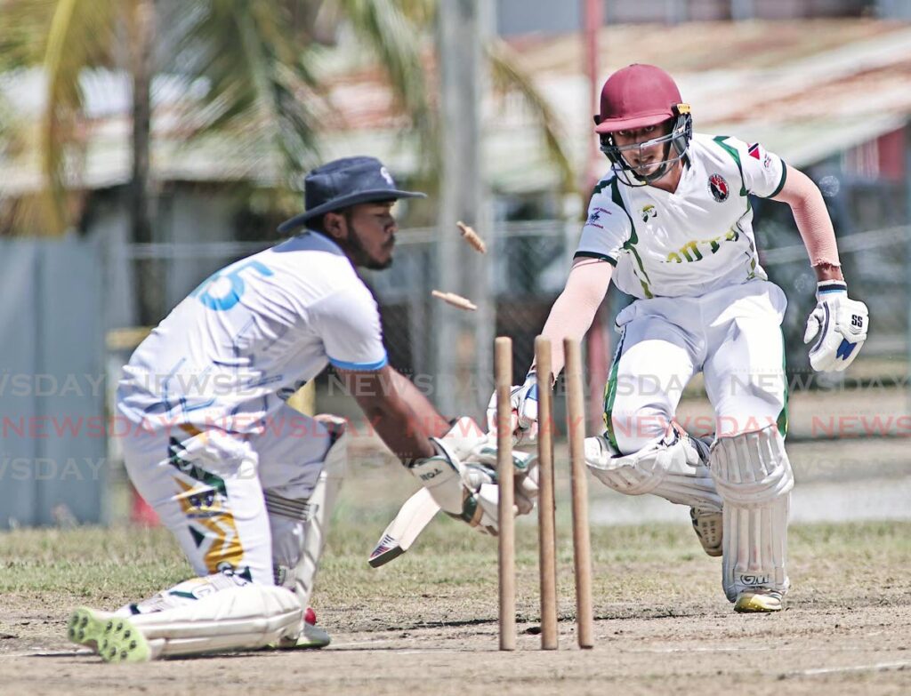 South Zone batsman Levi Ghanny is run out by South West Zone wicketkeeper Matthais Mahabir in the Under 17 Interzone cricket match at Lewis Street, San Fernando, on March 19. - Photo by Lincoln Holder 