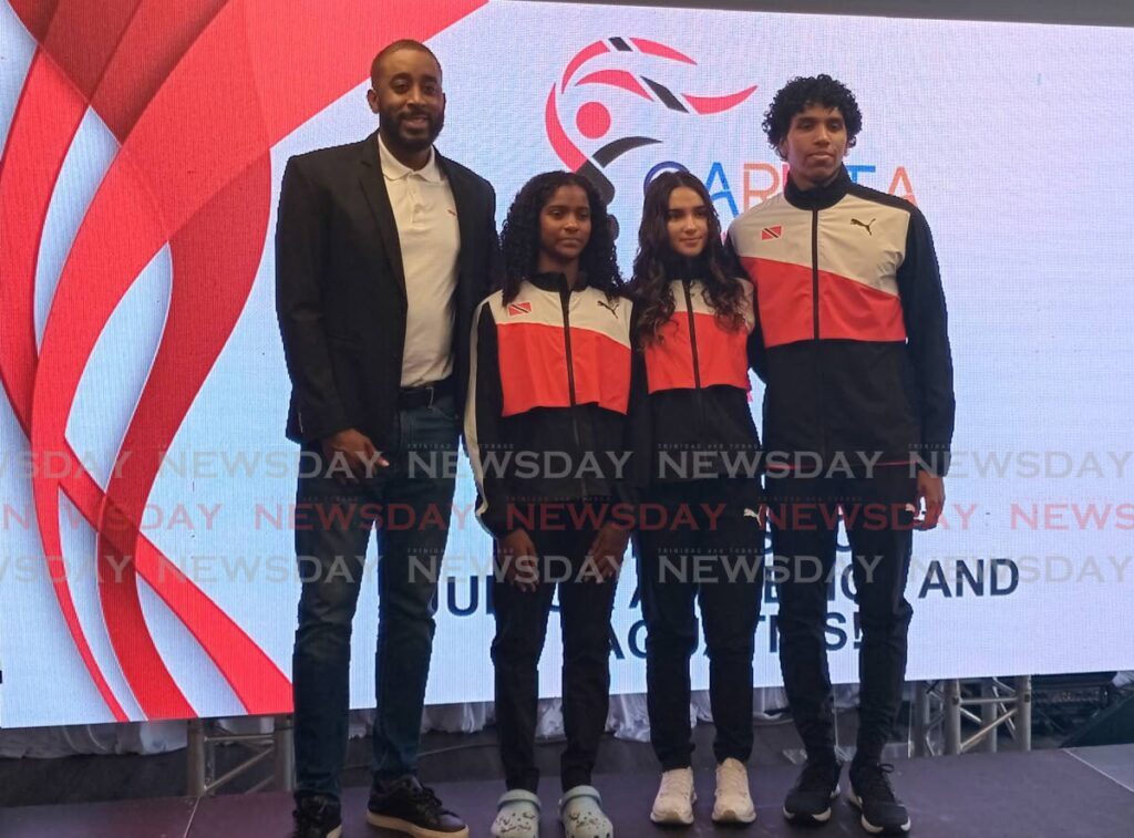 Former Carifta athlete Jehue Gordon, left, along with Carifta swimmers Zahara Anthony, Aimee Le Blanc and Zachary Anthony at the Carifta Games launch at the Hasely Crawford Stadium on March 20.   - Photo by Jelani Beckles