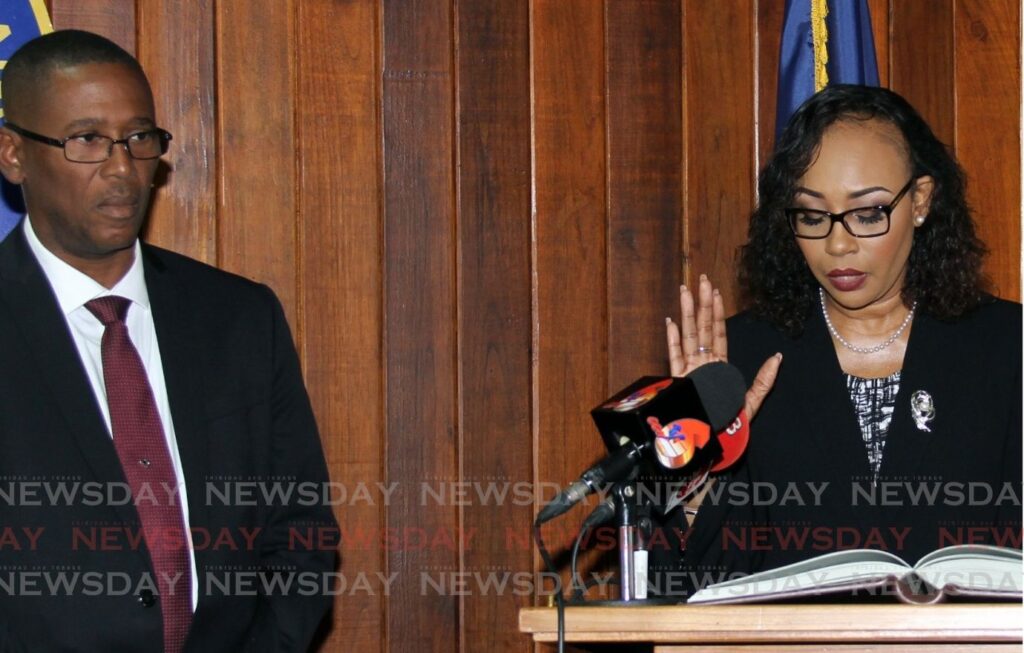 In this file photo, former chief magistrate Marcia Ayres-Caesar takes the oath to be a High Court judge in the presence of Chief Justice Ivor Archie at President's House in 2017. -